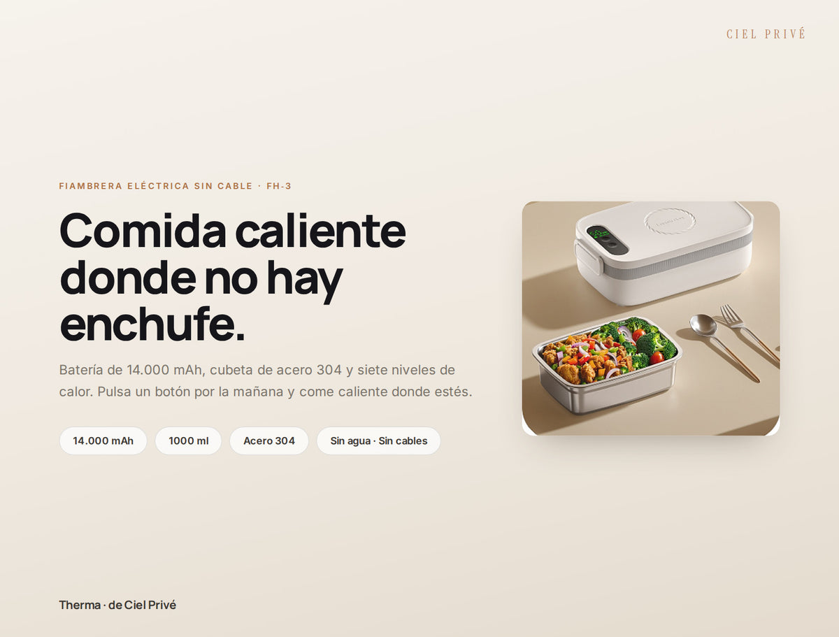 Fiambrera eléctrica Therma abierta con comida caliente sobre una mesa